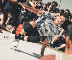 Street performer man-wearing-white-and-black-shirt-break-dancing-on-white-Picture by Wallace Chuck on Pexels