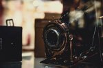 black-and-gray-camera-on-glass-top-surface-2786744 widescreen