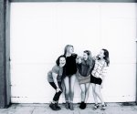 grayscale-photography-of-four-women-wearing-clothes-1065081